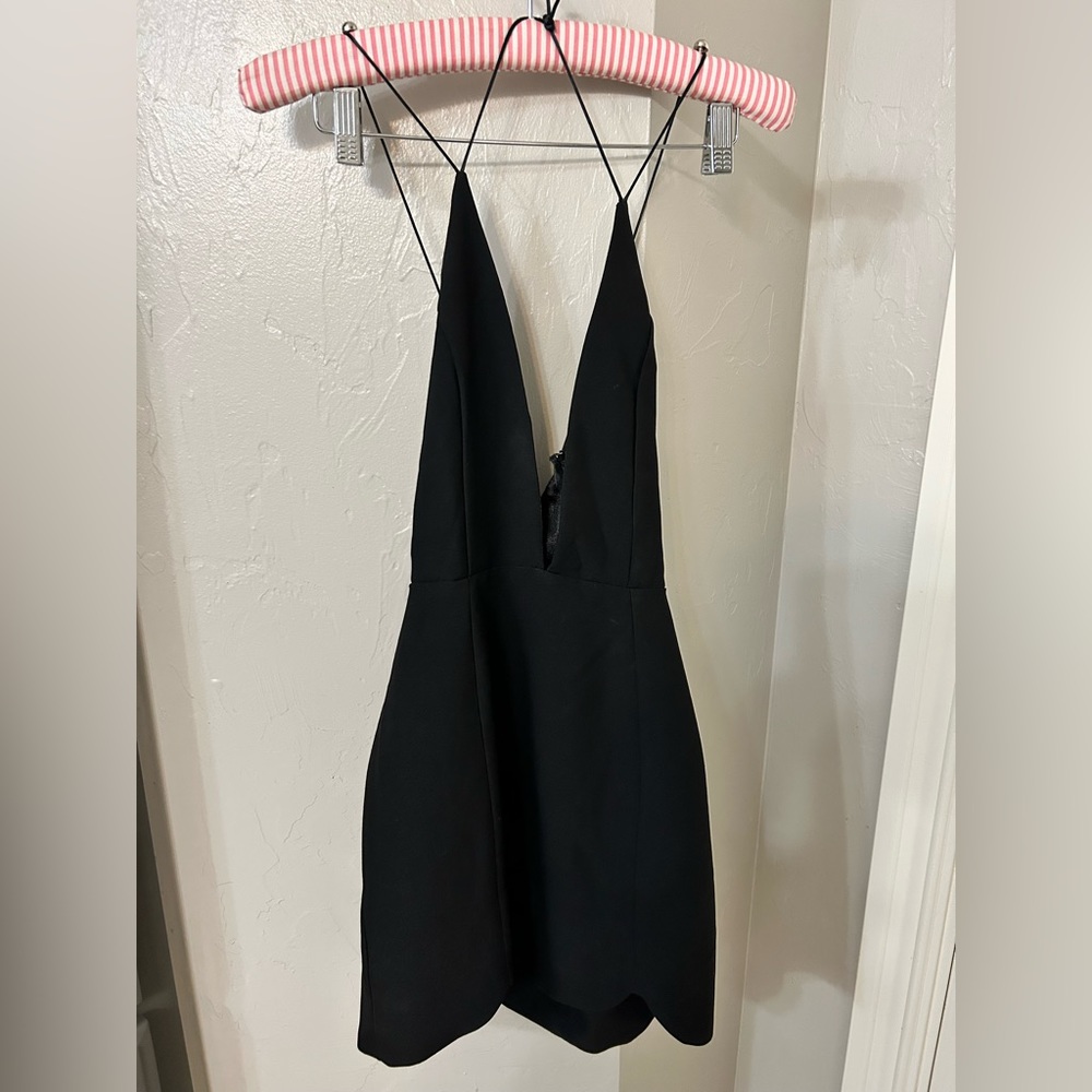 Low cut, strappy  back mini dress by Nasty Gal. Worn once.  Great for NYE!